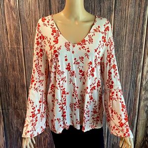 H & M size medium baby pale pink flowy boho blouse with red floral design